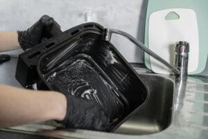 air fryer being deep cleaned